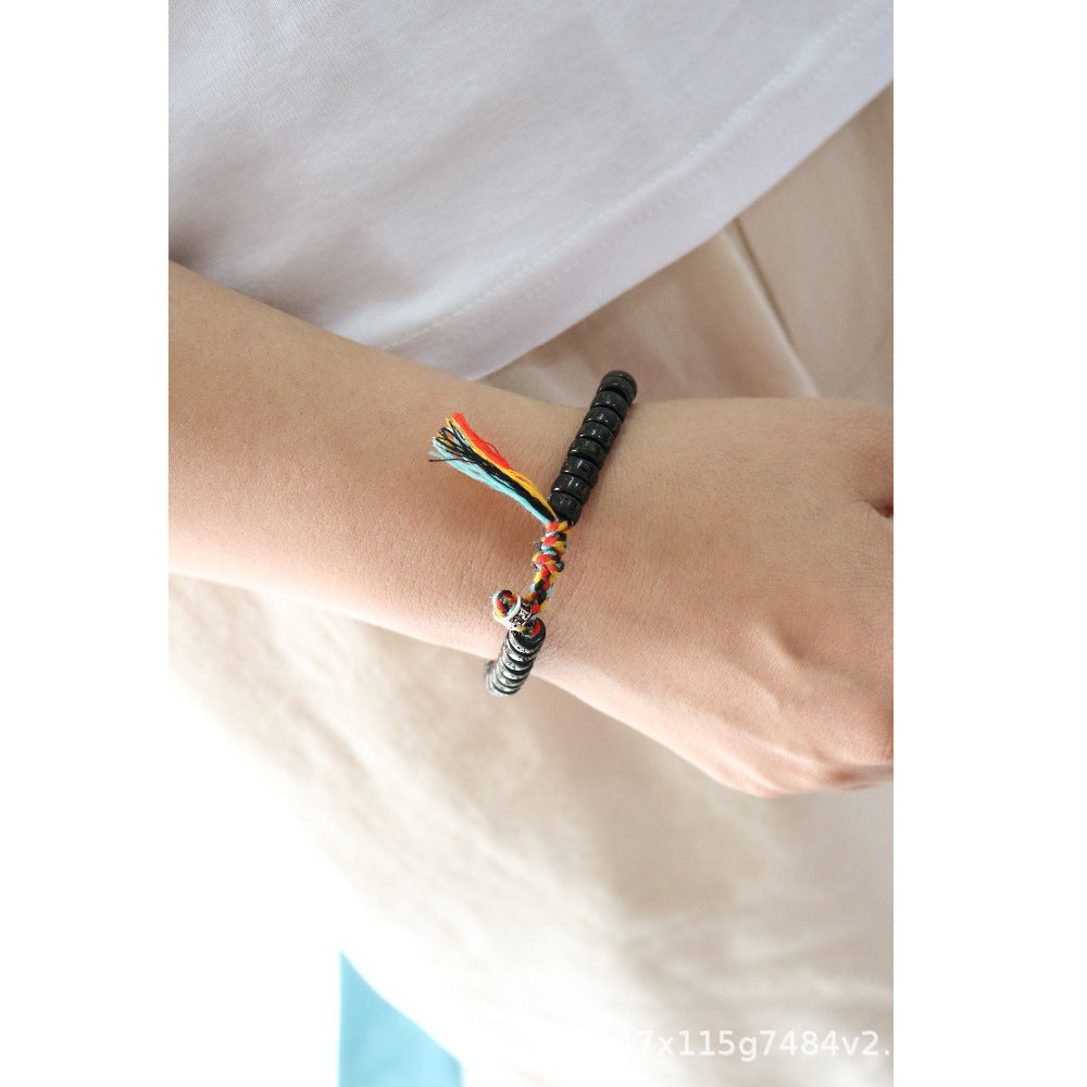 Bracelet Tibétain Bouddhiste en perle de Noix de Coco taillées et gravées.